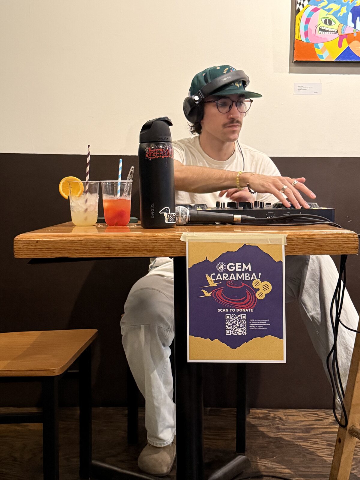 DJ set with flyer on the table
